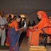 Poojya Swamiji presenting Jnaana Prasad to Smt. Padma Kutty